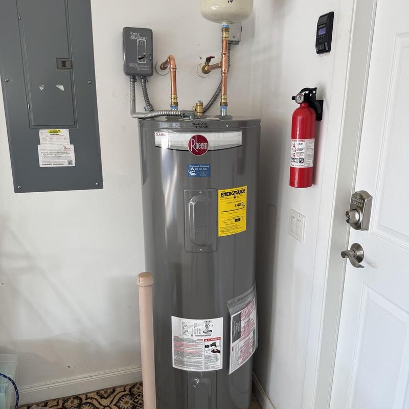 Electric water heater with expansion tank installed