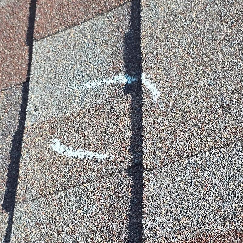 Asphalt roof shingles with hail impact marking Asphalt roof shingles with hail impact marking