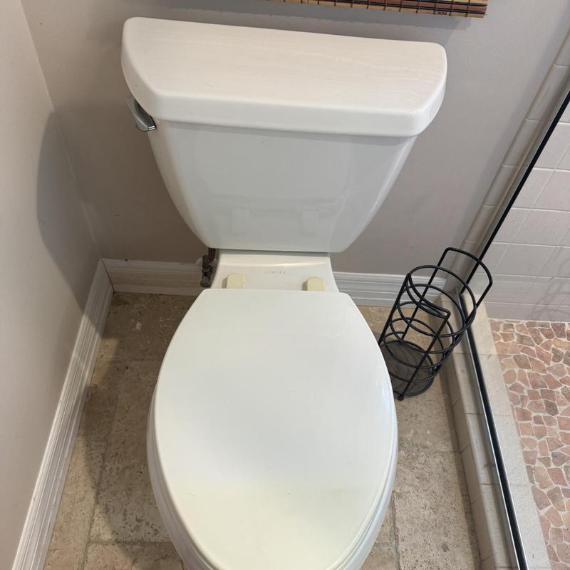 Toilet fill valve installation and testing in bathroom