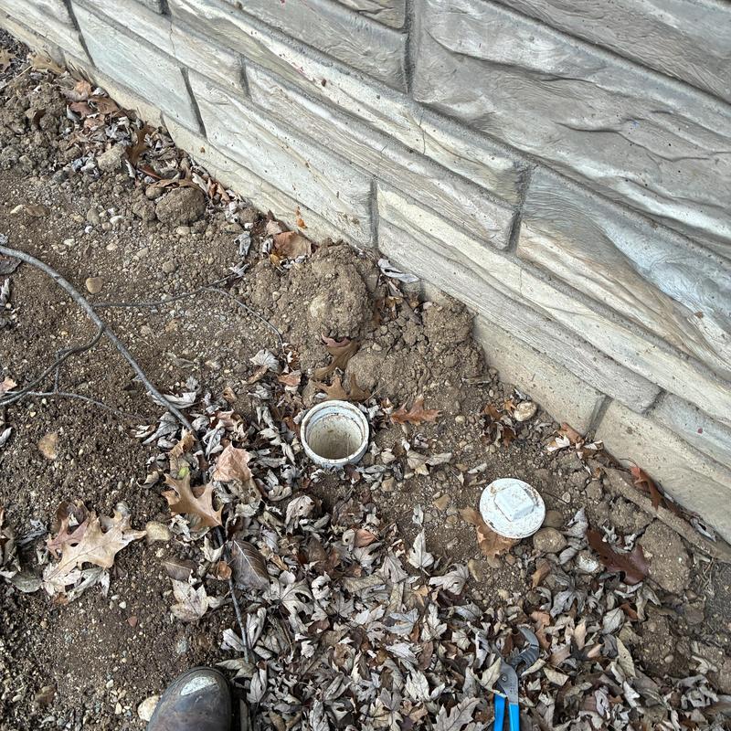 Main sewer line cleanout with cap removed outdoors