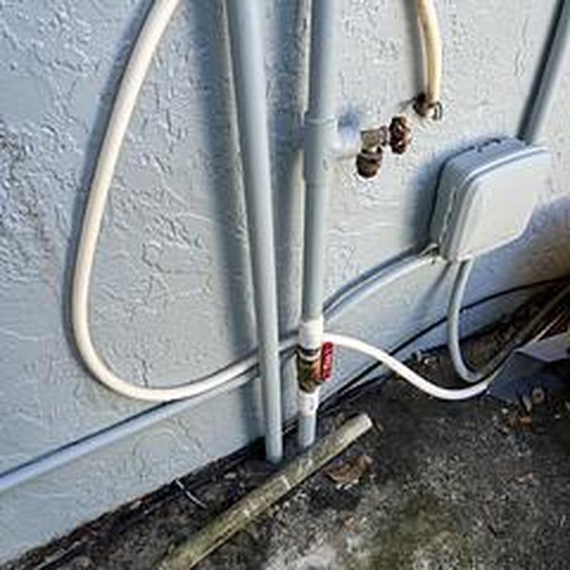 1-inch brass ball valve with PVC adapters installation outdoors