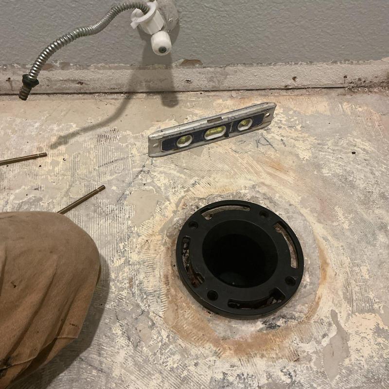 Toilet flange replacement and leveling on concrete floor