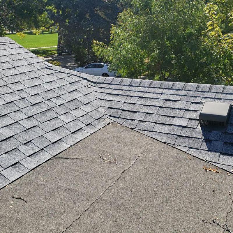 Flat roof to shingle roof valley with insufficient overlap