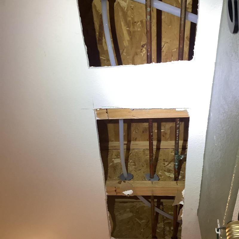 PEX water supply lines rerouted inside ceiling cavity
