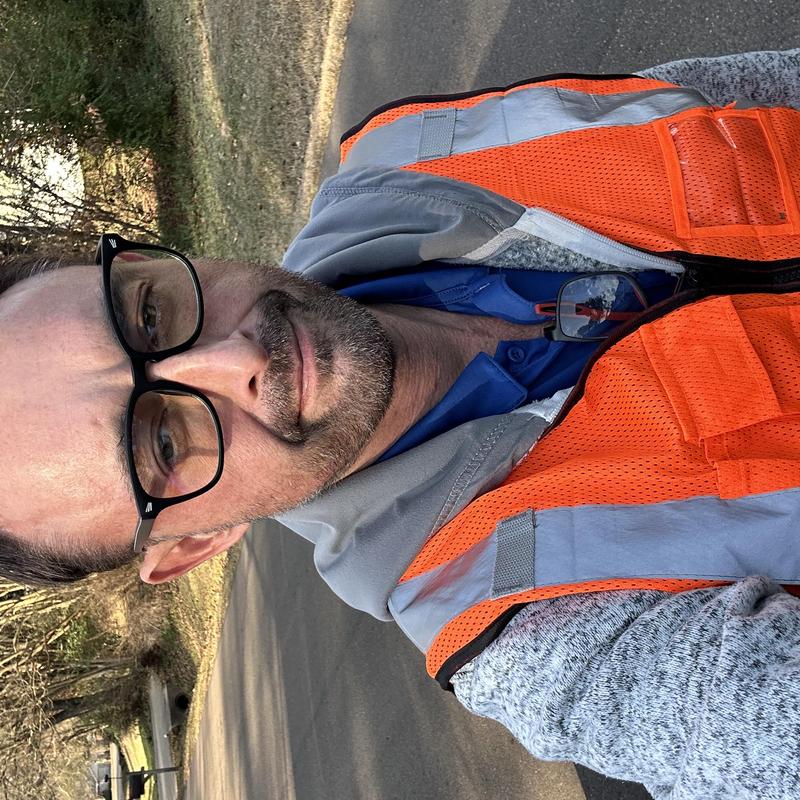Safety vest worn by roofer during door inspections
