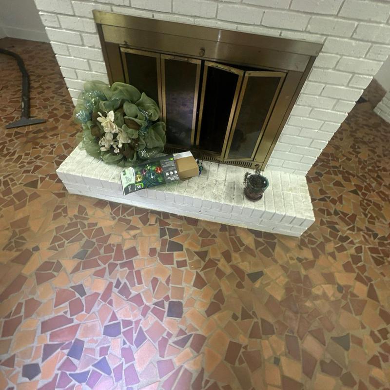 Fireplace with brass doors and tiled hearth inspection