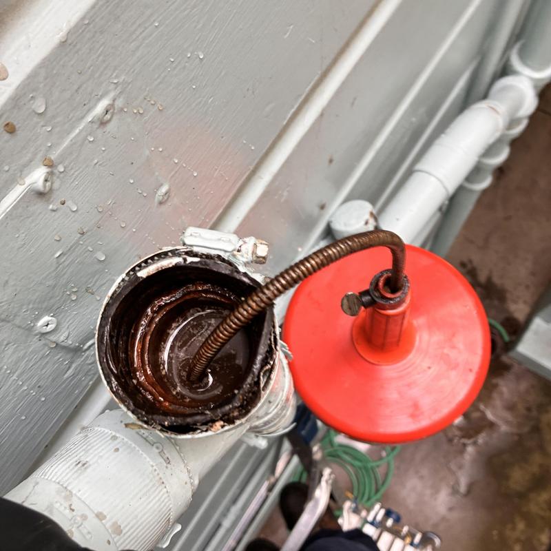 Kitchen sink drain cabling and grease removal