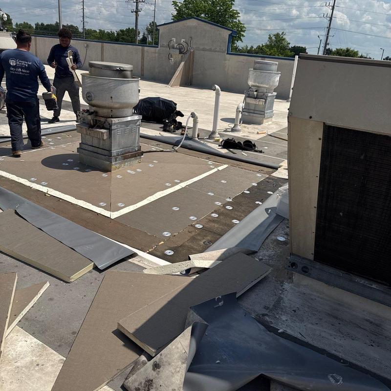 Commercial roof flashing and ventilation units on roof