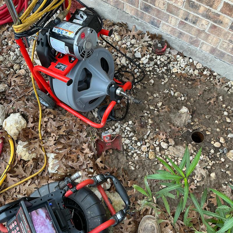 Yard clay sewer line camera inspection and root clearing