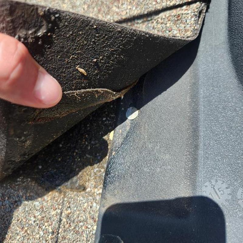 Roof flashing inspection with lifted shingle edge
