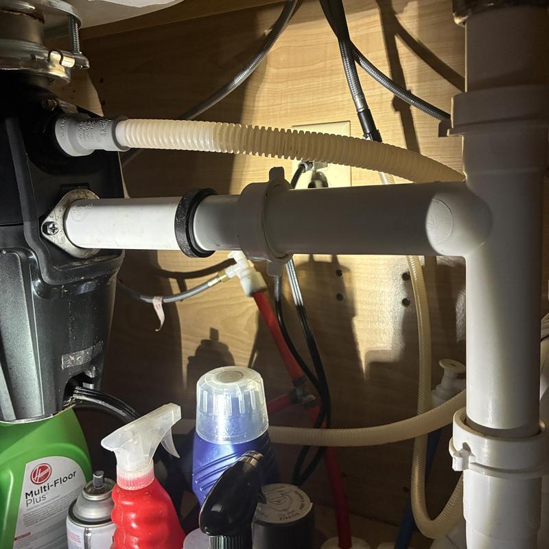 Dishwasher drain tube reinstalled on garbage disposal