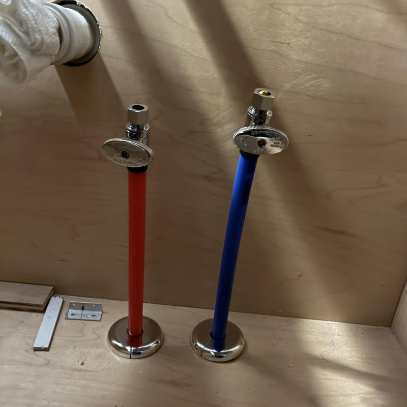 Lavatory sink hot and cold shut off valves installed