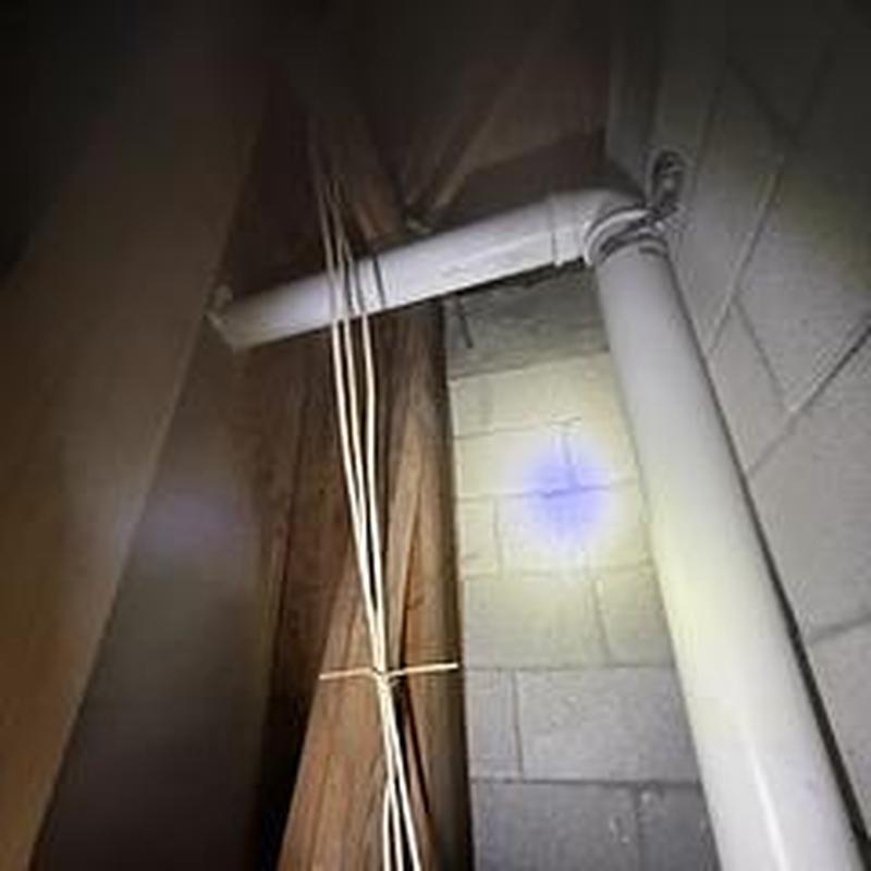 Concentric vent pipe connection in attic with wiring
