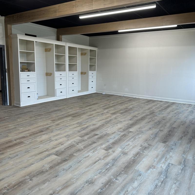 Luxury vinyl plank flooring with white cove base installation Luxury vinyl plank flooring with white cove base installation