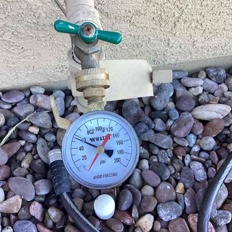 Water pressure gauge with ball valve on pipe