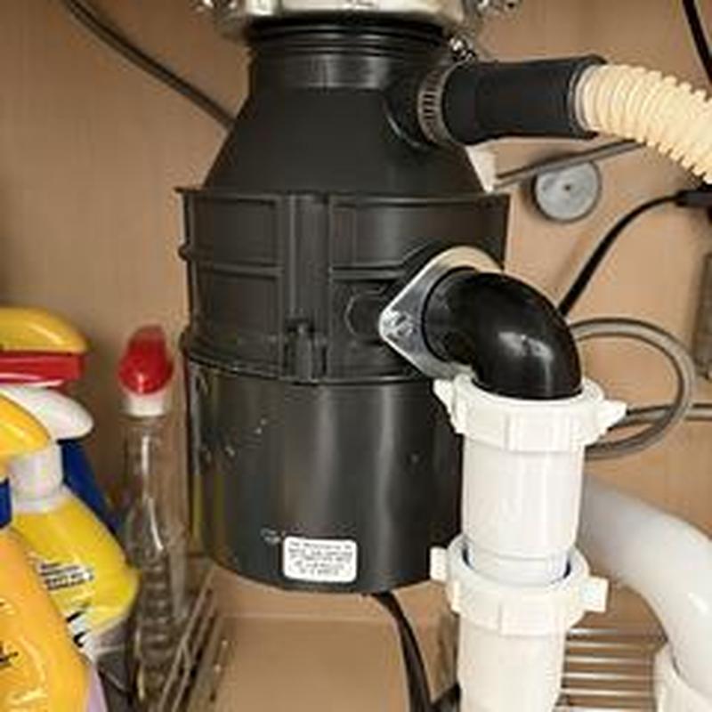 Garbage disposal reset and tested under sink