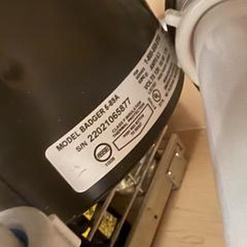 Garbage disposal unit reset and tested in kitchen sink