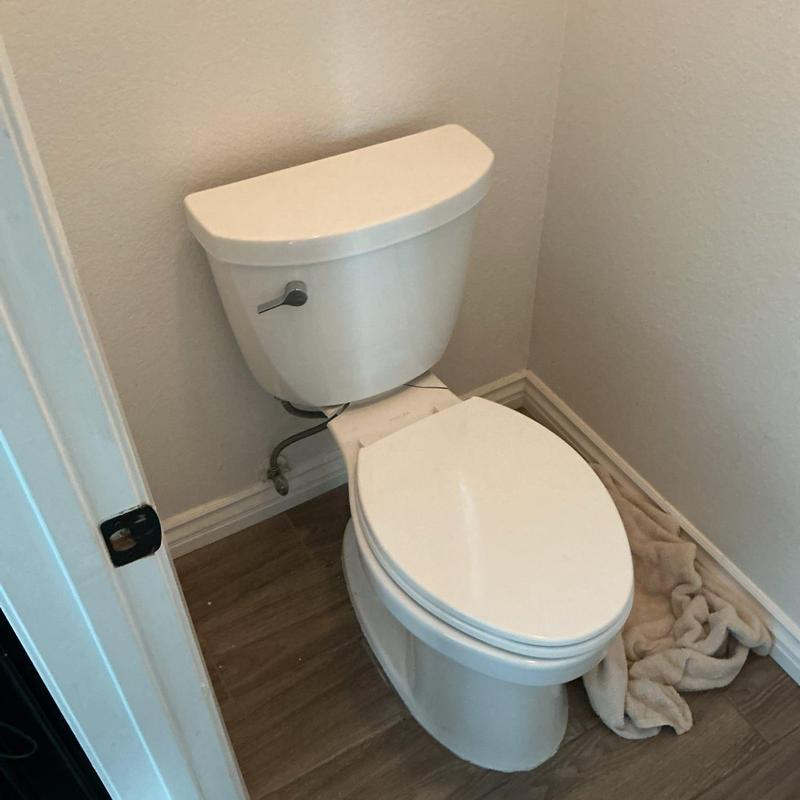 Toilet installation with new wax seal and hardware