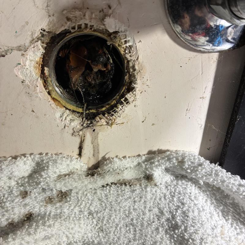 Vanity sink drain opening with buildup and residue