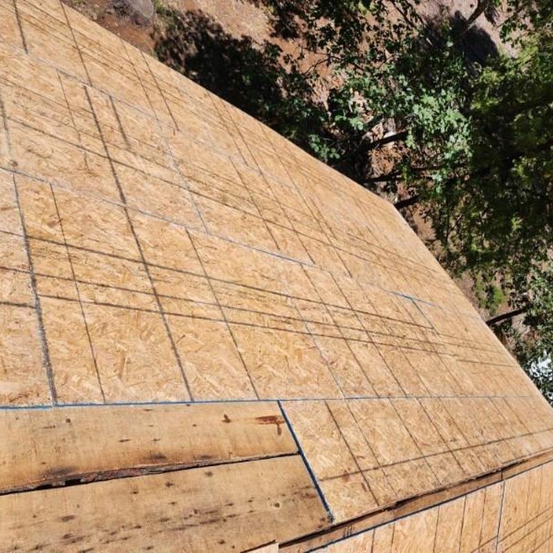 Roof plywood installation with layout markings