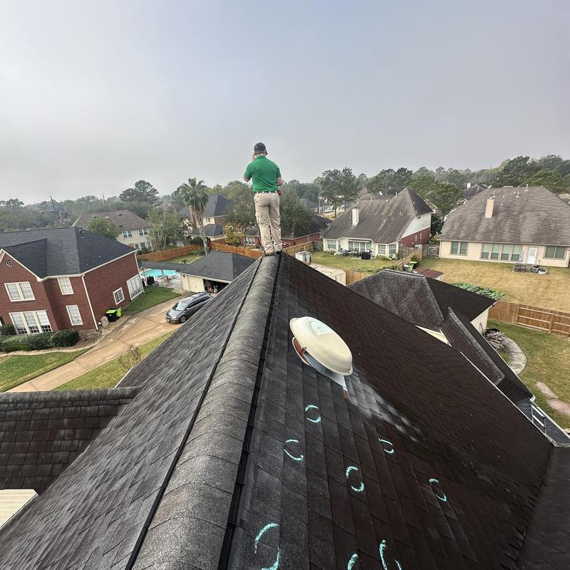 Asphalt shingle roof with marked hail damage in Friendswood, TX Asphalt shingle roof with marked hail damage in Friendswood, TX