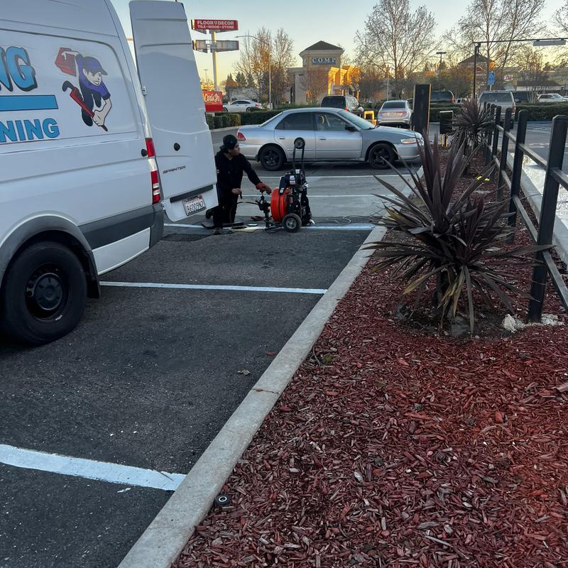 Grease main drain snake clearing outside restaurant