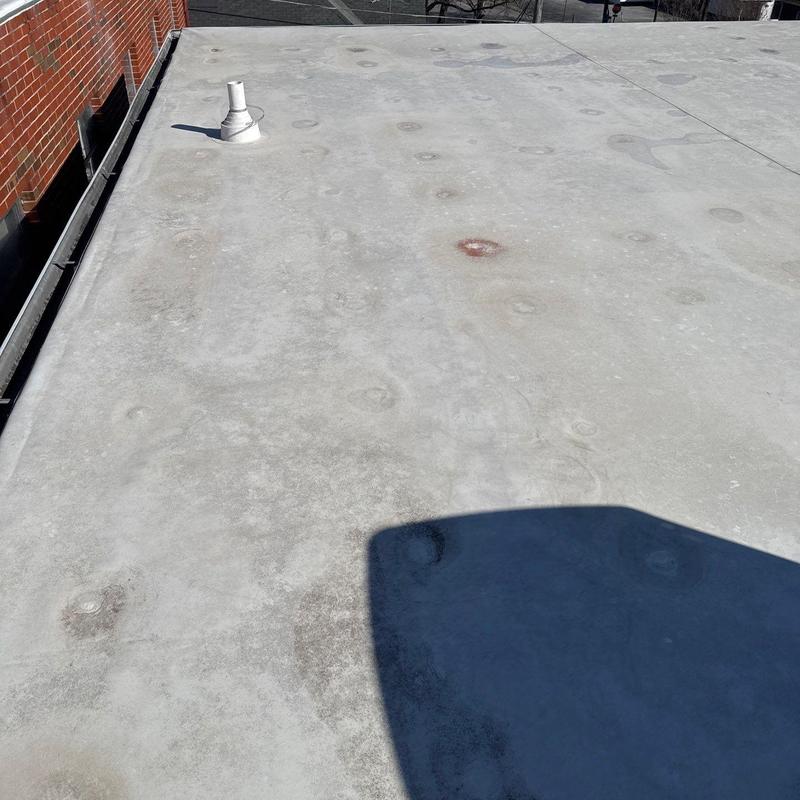 Commercial flat roof hail damage and wear marks