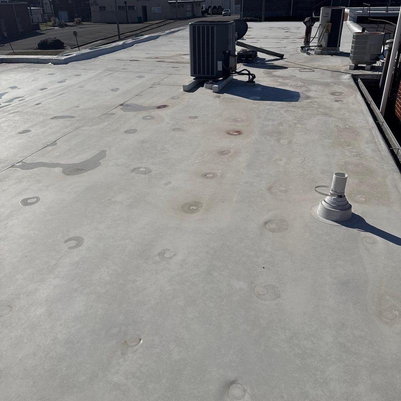 Commercial roof hail damage and drainage inspection