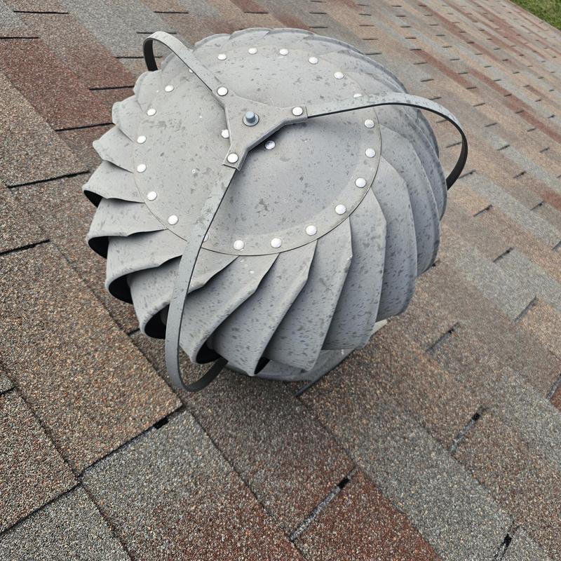 Roof turbine vent with hail storm damage on shingles