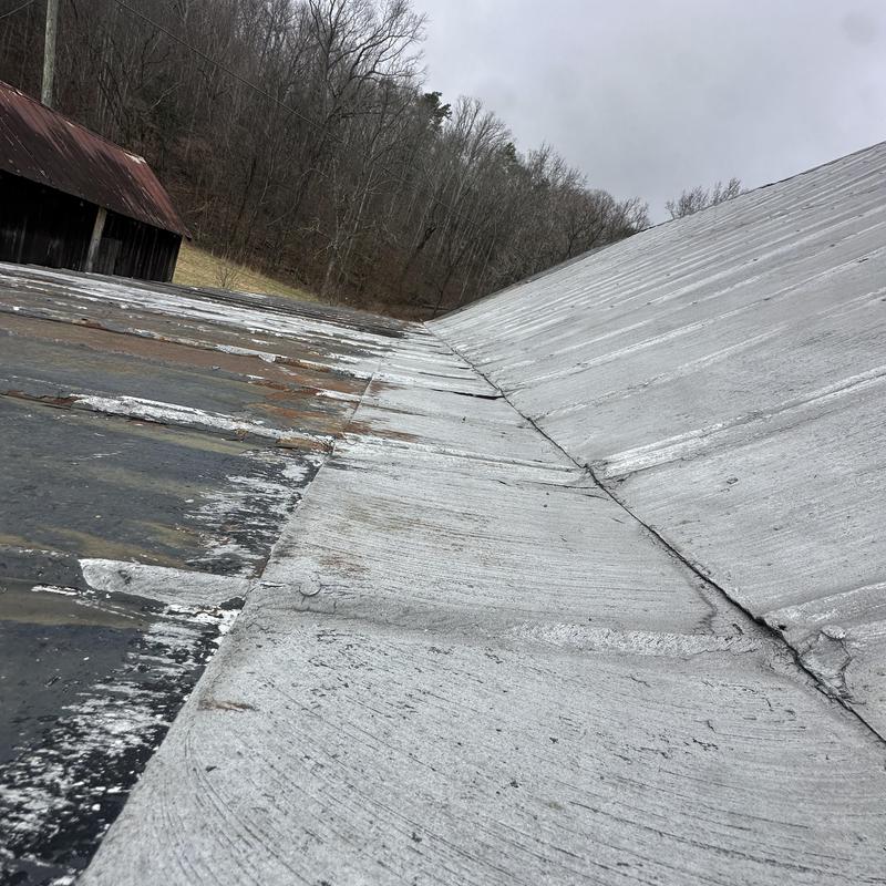 Metal roof panels with rust and wear damage
