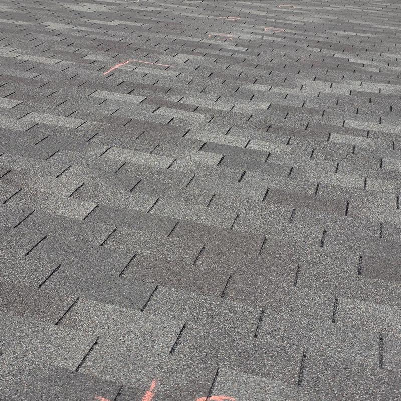 Asphalt shingle roof with hail damage markings