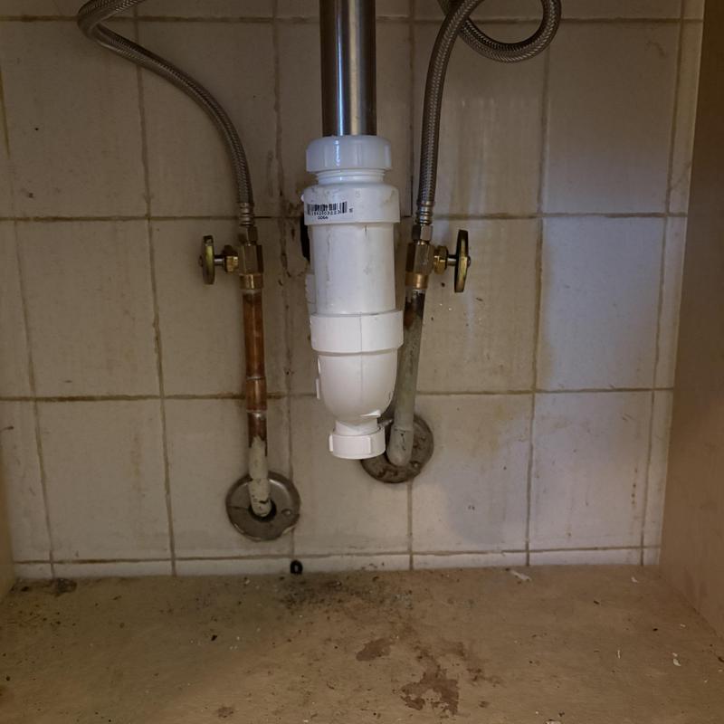 PVC P-trap drainage pipe under bathroom vanity PVC P-trap drainage pipe under bathroom vanity