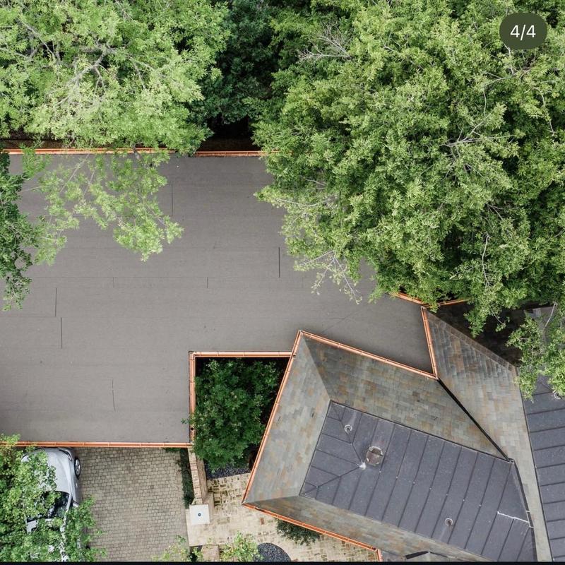 Modified bitumen roof with copper seam and slate repairs