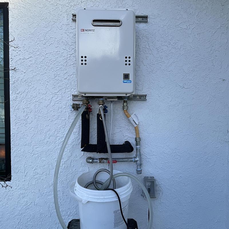 Tankless water heater flushing setup with hoses