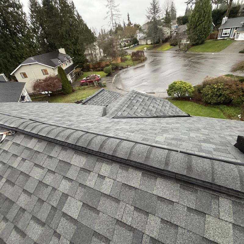 Roof ridge vent installation on asphalt shingles