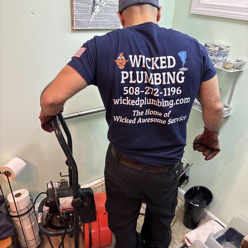 Main drain with plumber using drain cleaning machine