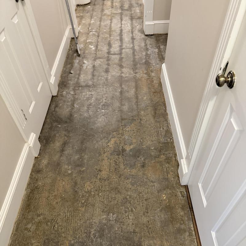 Concrete subfloor stripped for vinyl plank installation Concrete subfloor stripped for vinyl plank installation