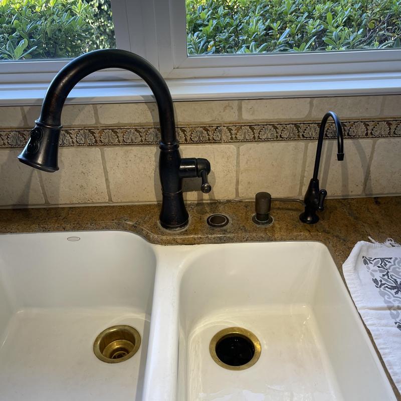 Delta Venetian bronze kitchen sink faucet and soap dispenser