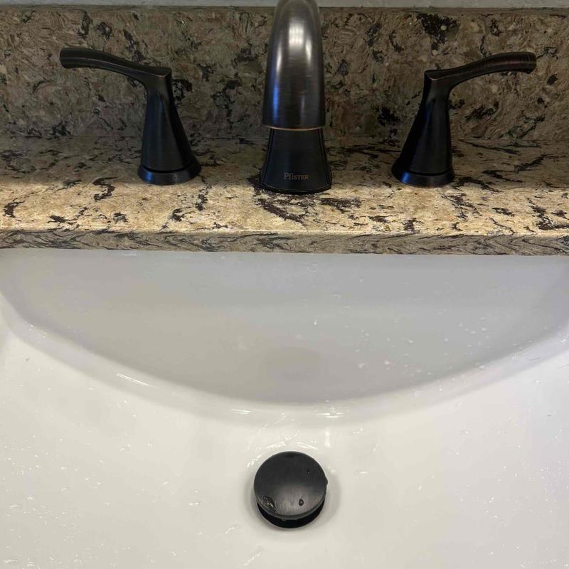 Pfister bathroom faucet set installed on granite countertop