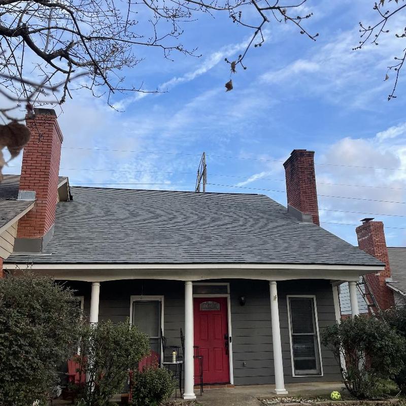 Architect shingles roof on residential home with chimneys Architect shingles roof on residential home with chimneys