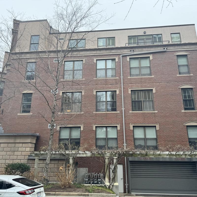 Andersen window replacement on brick building facade