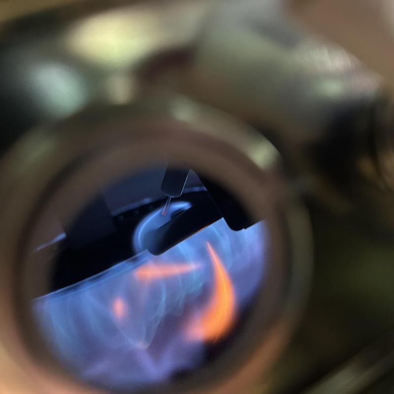 Water heater burner flame during ignition system check