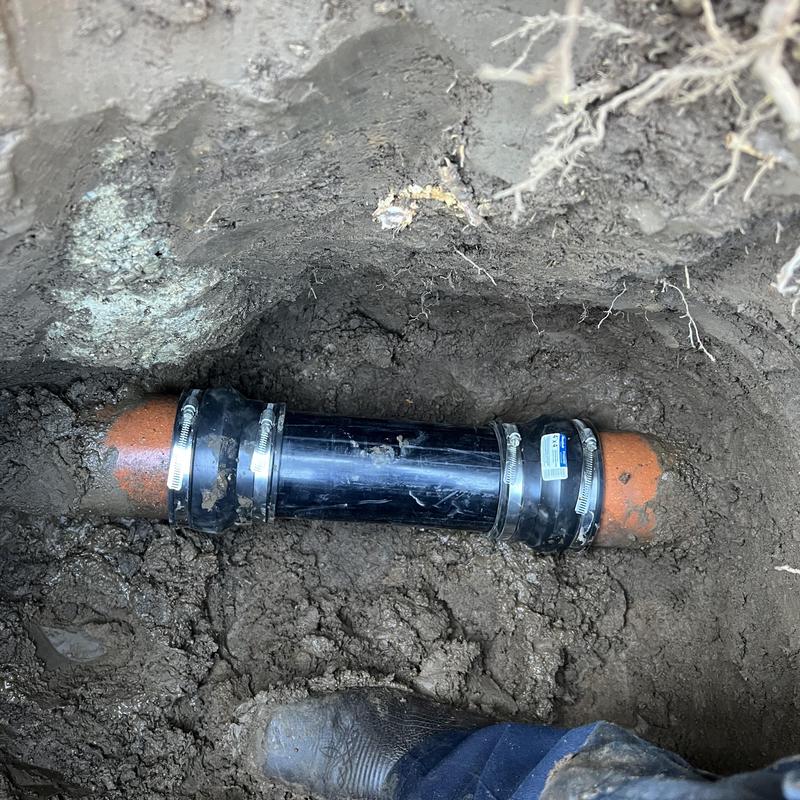 Sewer line with new couplings and 4-inch pipe repair