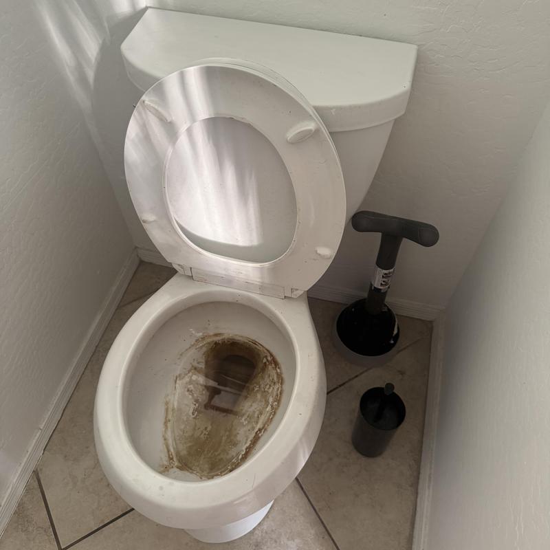 Toilet bowl with heavy calcium buildup, Goodyear AZ