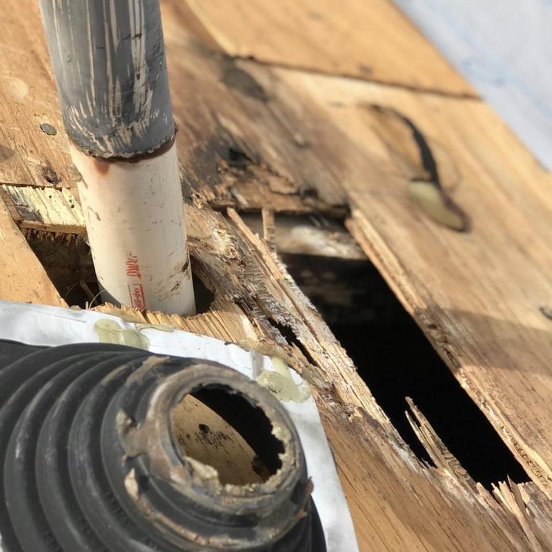Bathroom roof vent pipe with damaged wood decking