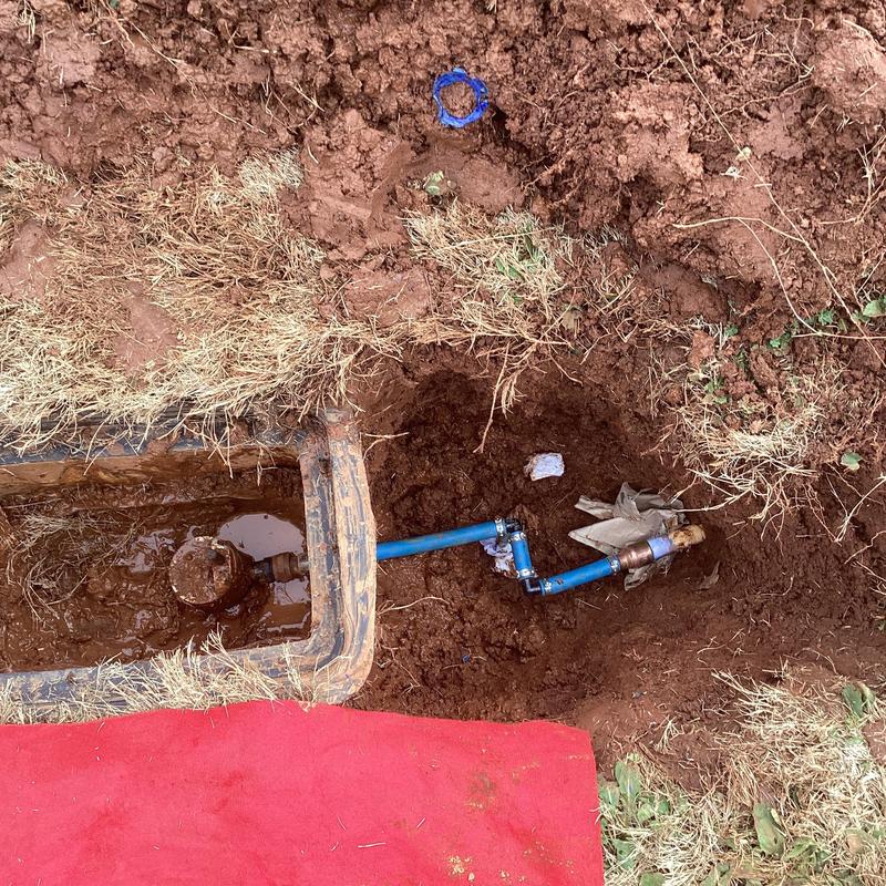 Water meter valve and blue pipe repair in soil trench