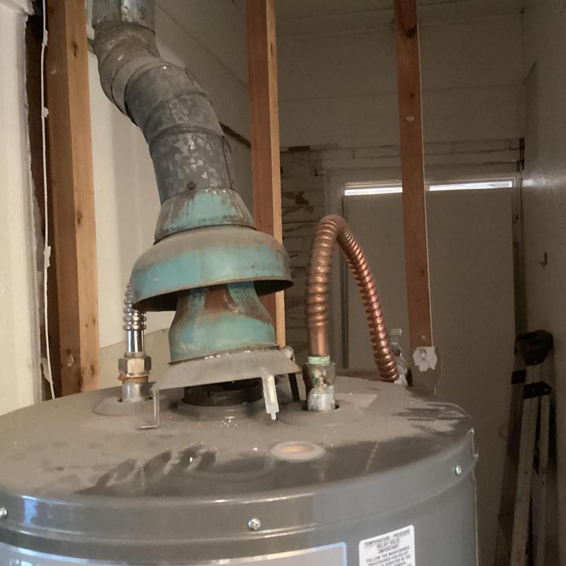 Rheem water heater with vent and gas piping installation