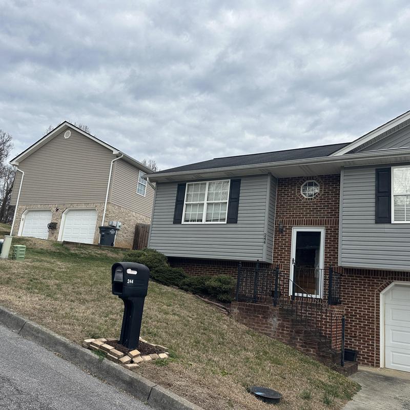 Asphalt shingle roof on residential split-level home