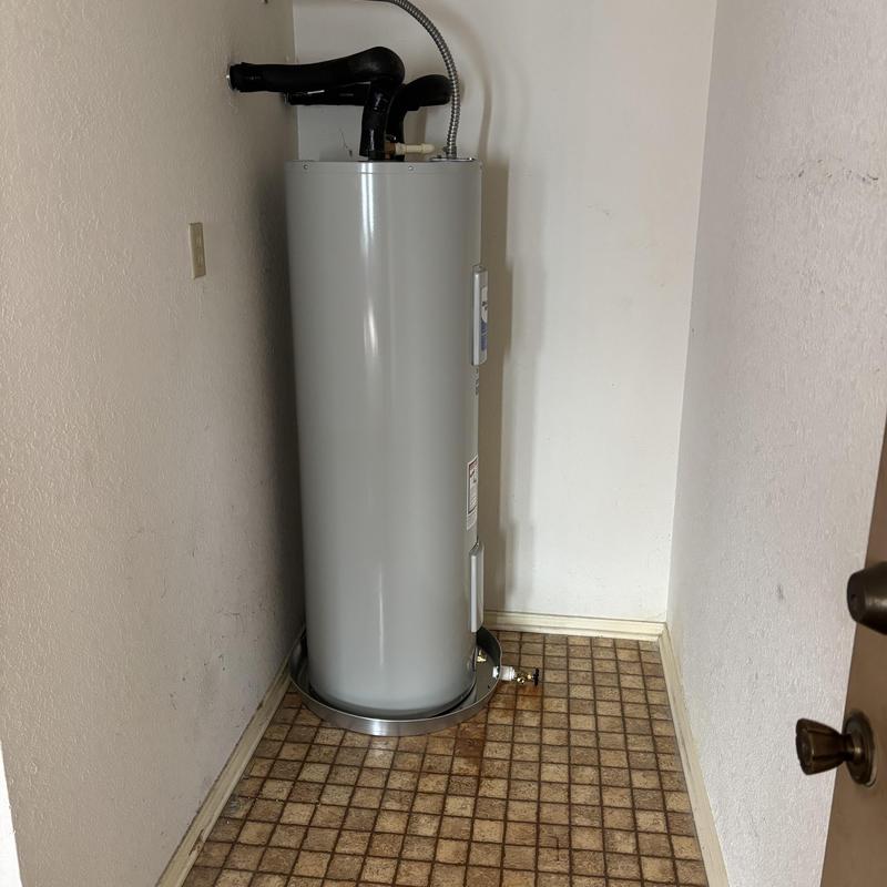 50-gallon water heater installation in utility room
