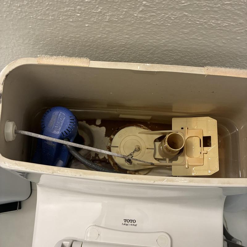 Toilet fill valve inside tank with replacement parts